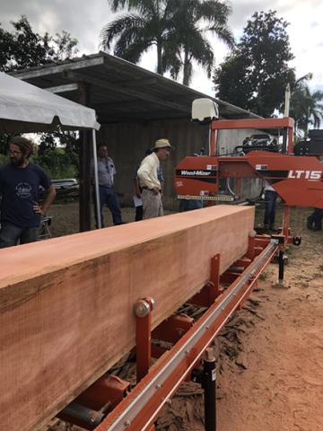 First salvaged mahogany log from El Yunque National Forest being milled at a demonstration workshop.