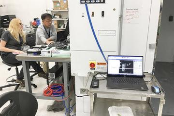 Scientist Moon Kim and a NASA intern Rachel Tucker setting up a hyperspectral imagery monitoring system.