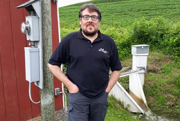 Donnacha Doody standing in front of an experimental watershed.