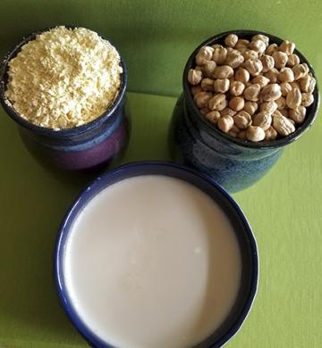 A container of chickpeas, a container of chickpea flour and a container of yogurt fortified with chickpea flour.