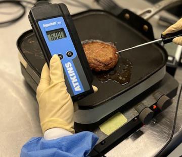 A digital thermometer in a plant burger