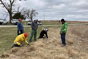 Four students and an instructor collecting pre-burn data.