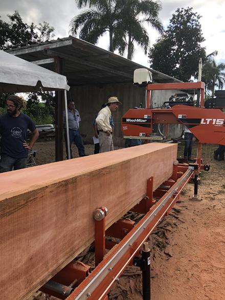 First salvaged mahogany log from El Yunque National Forest being milled at a demonstration workshop.