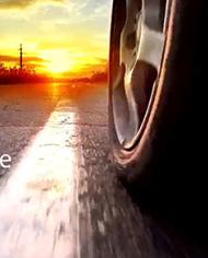 The text "A 'Greener' Tire" appears over an image of an upright tire on a road.
